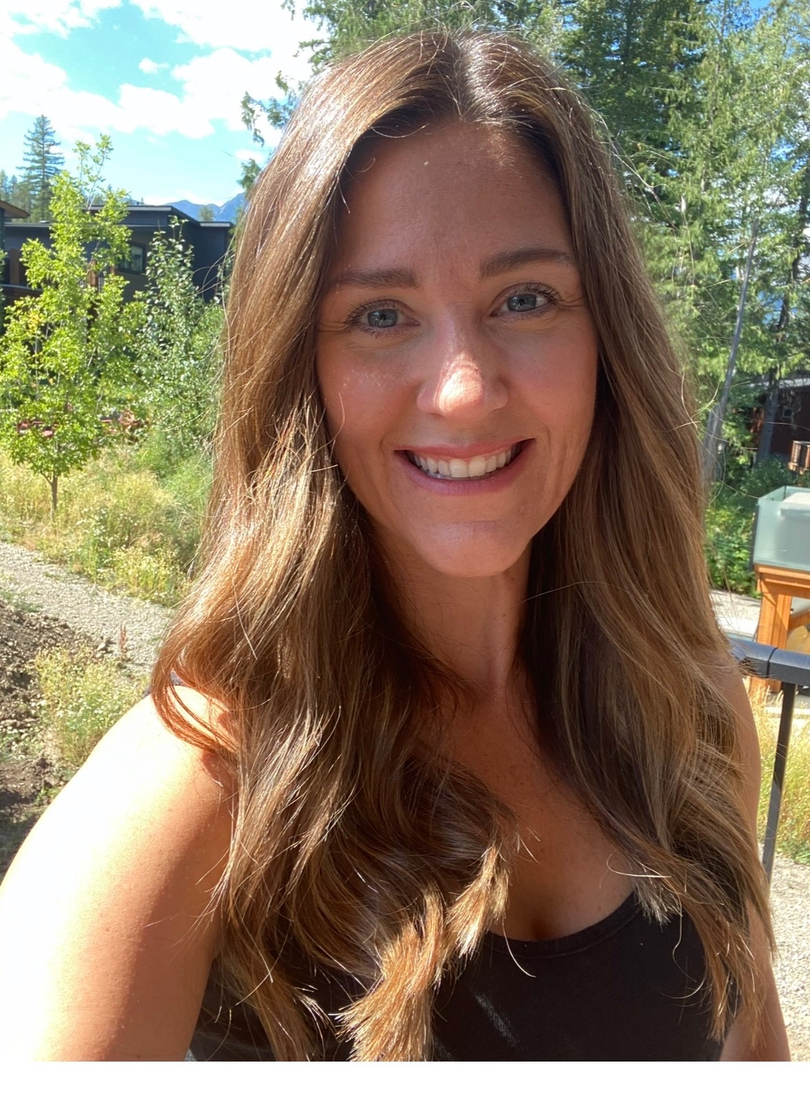 Ms. Cheryl smiling outdoors in Fernie